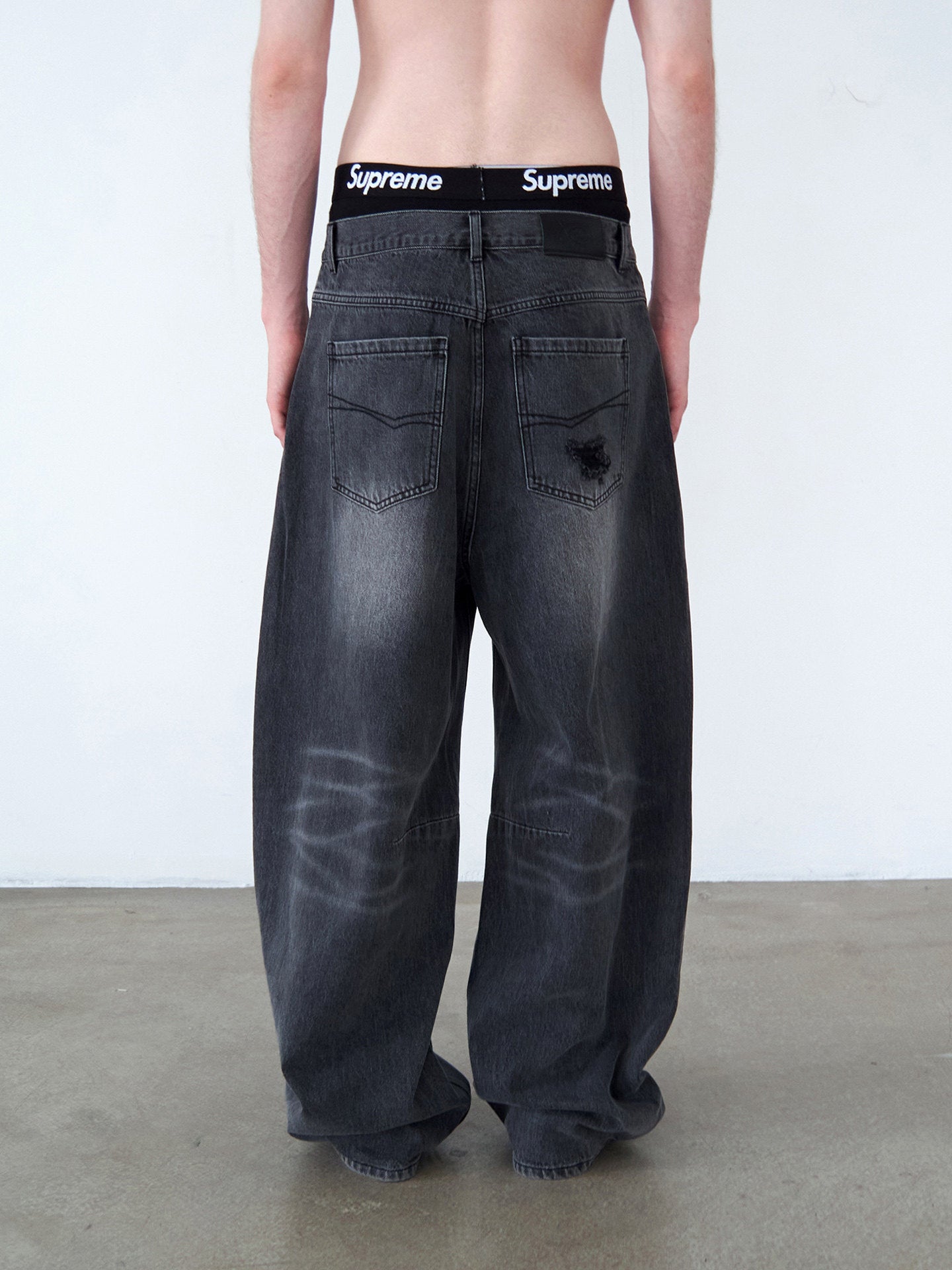 Distressed Patchwork Curved-Cut Denim Pants