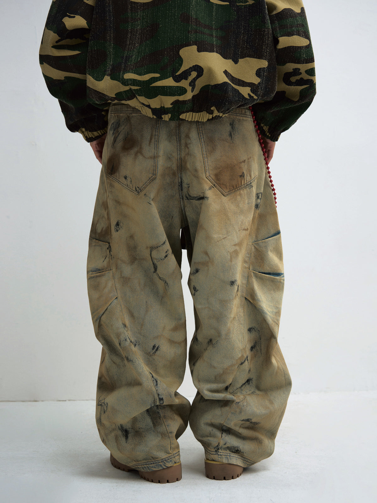 Mud-dyed wide-leg jeans