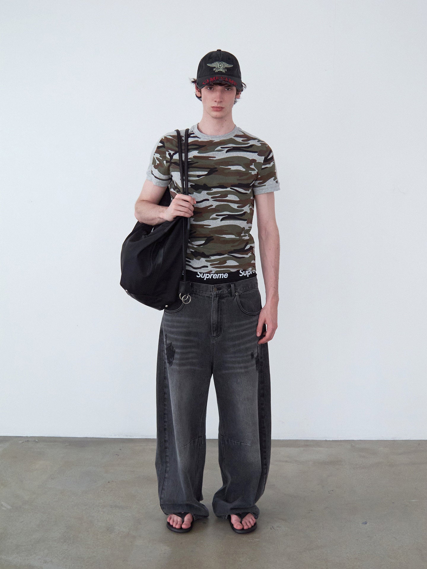 Distressed Patchwork Curved-Cut Denim Pants