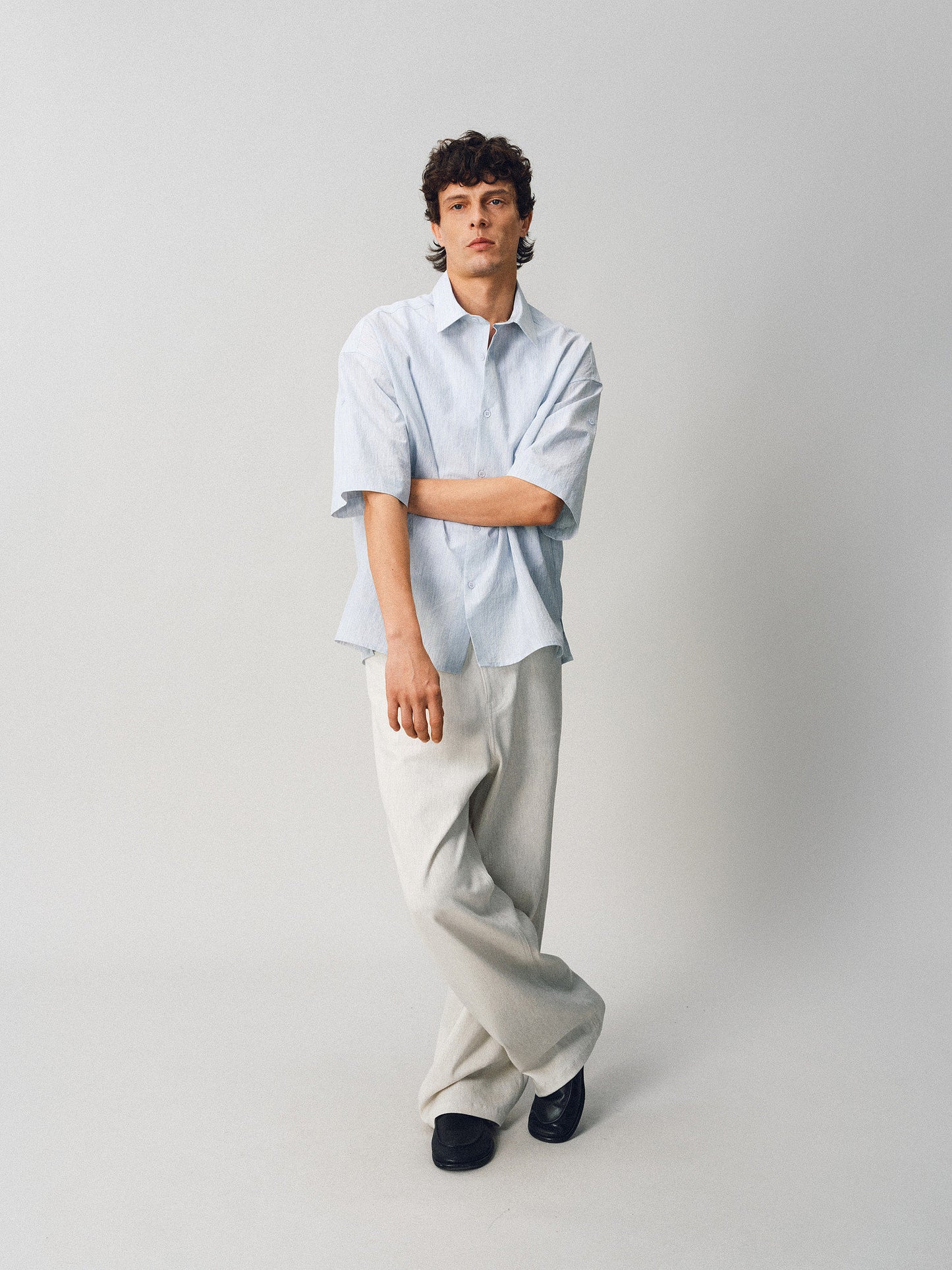 A relaxed-fit shirt with rolled sleeves