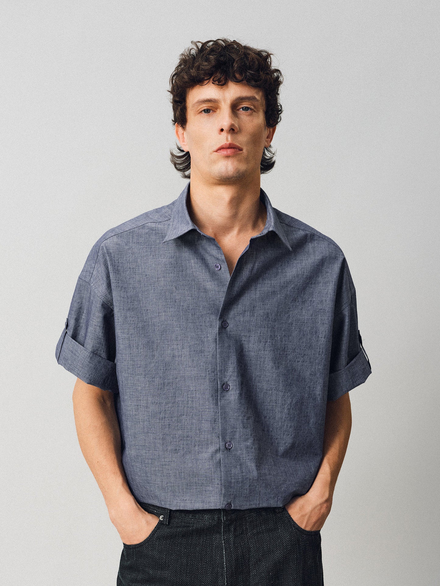 A relaxed-fit shirt with rolled sleeves