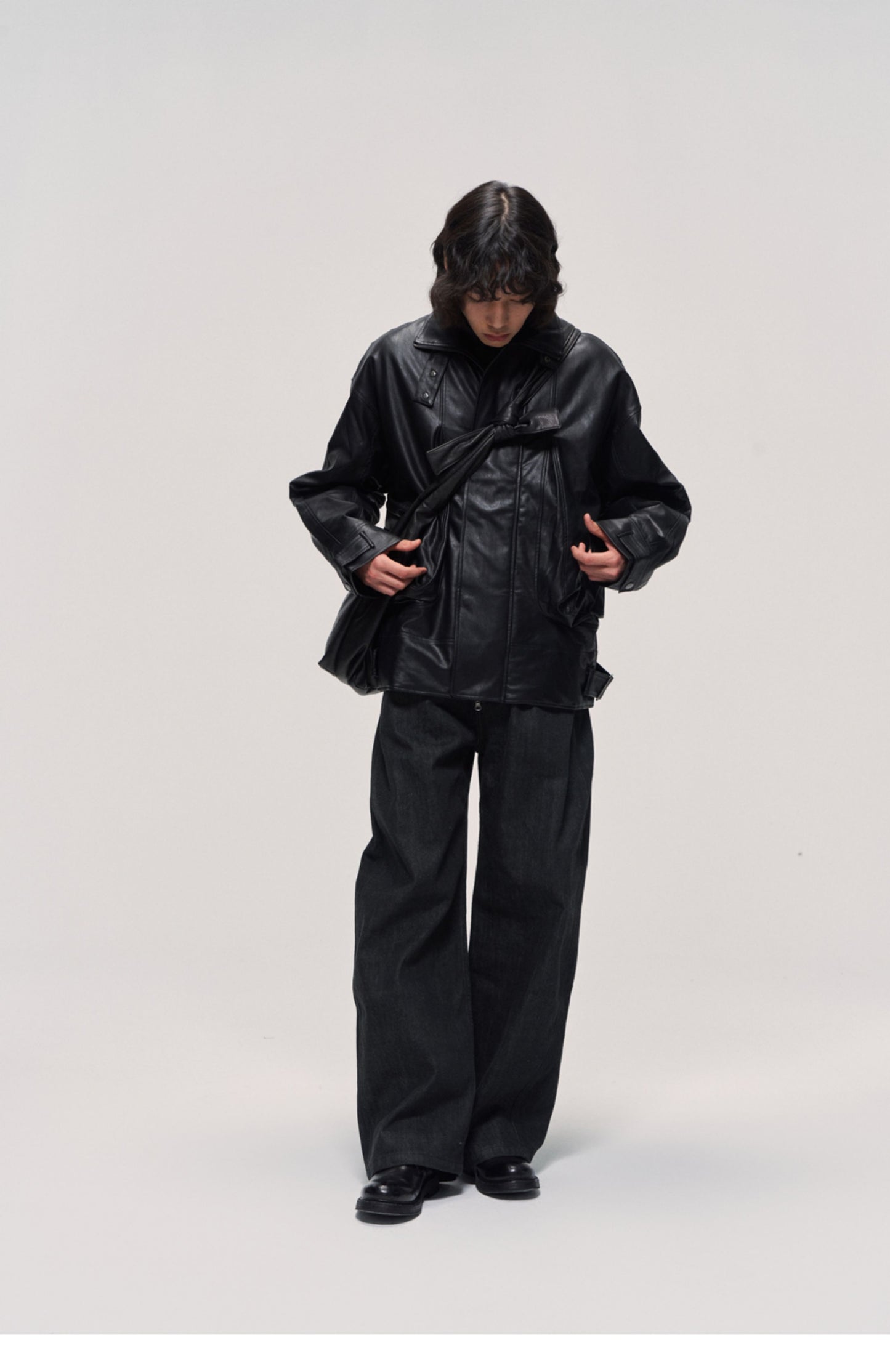 Damaged mid-length leather jacket