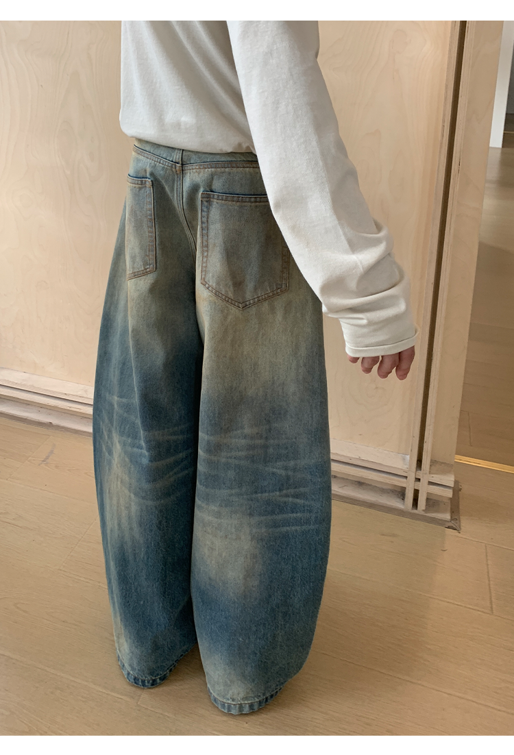 Mud-dyed wide-leg jeans