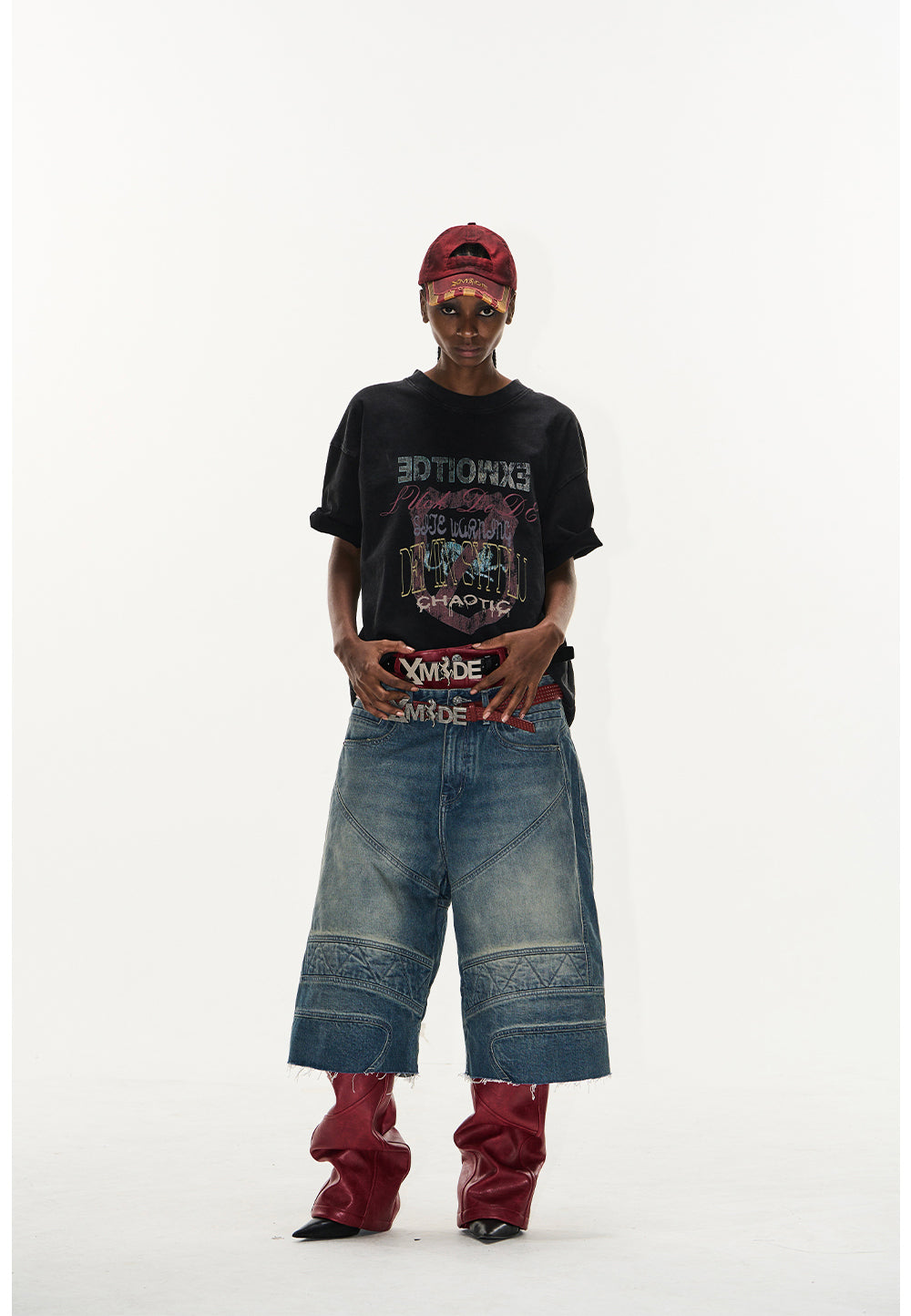 Wash-processed distressed denim shorts