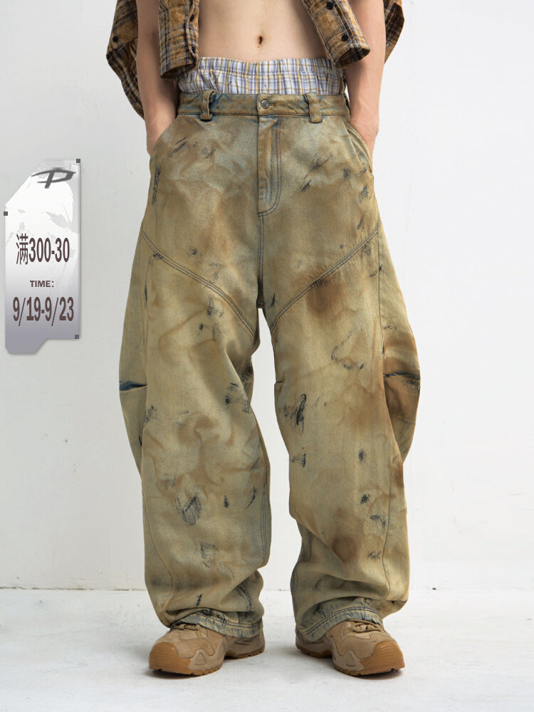 Mud-dyed wide-leg jeans